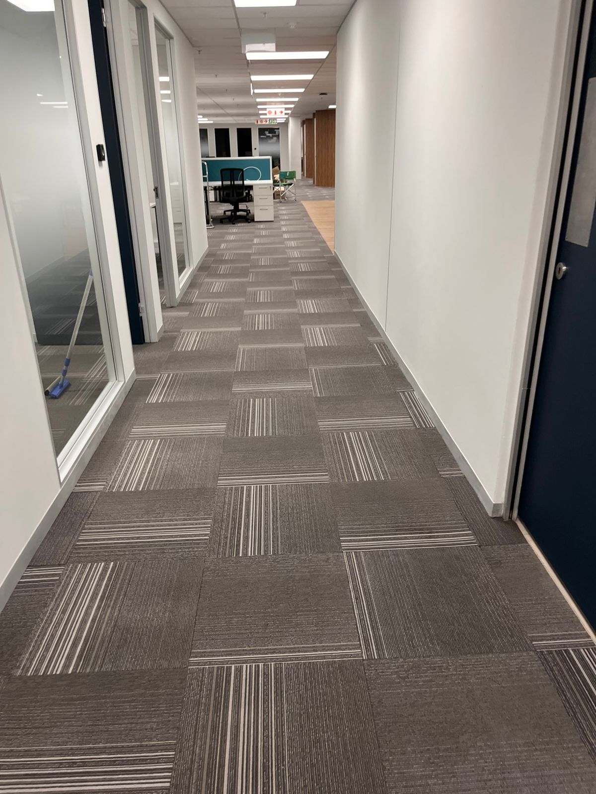View down a hallway with glass walls